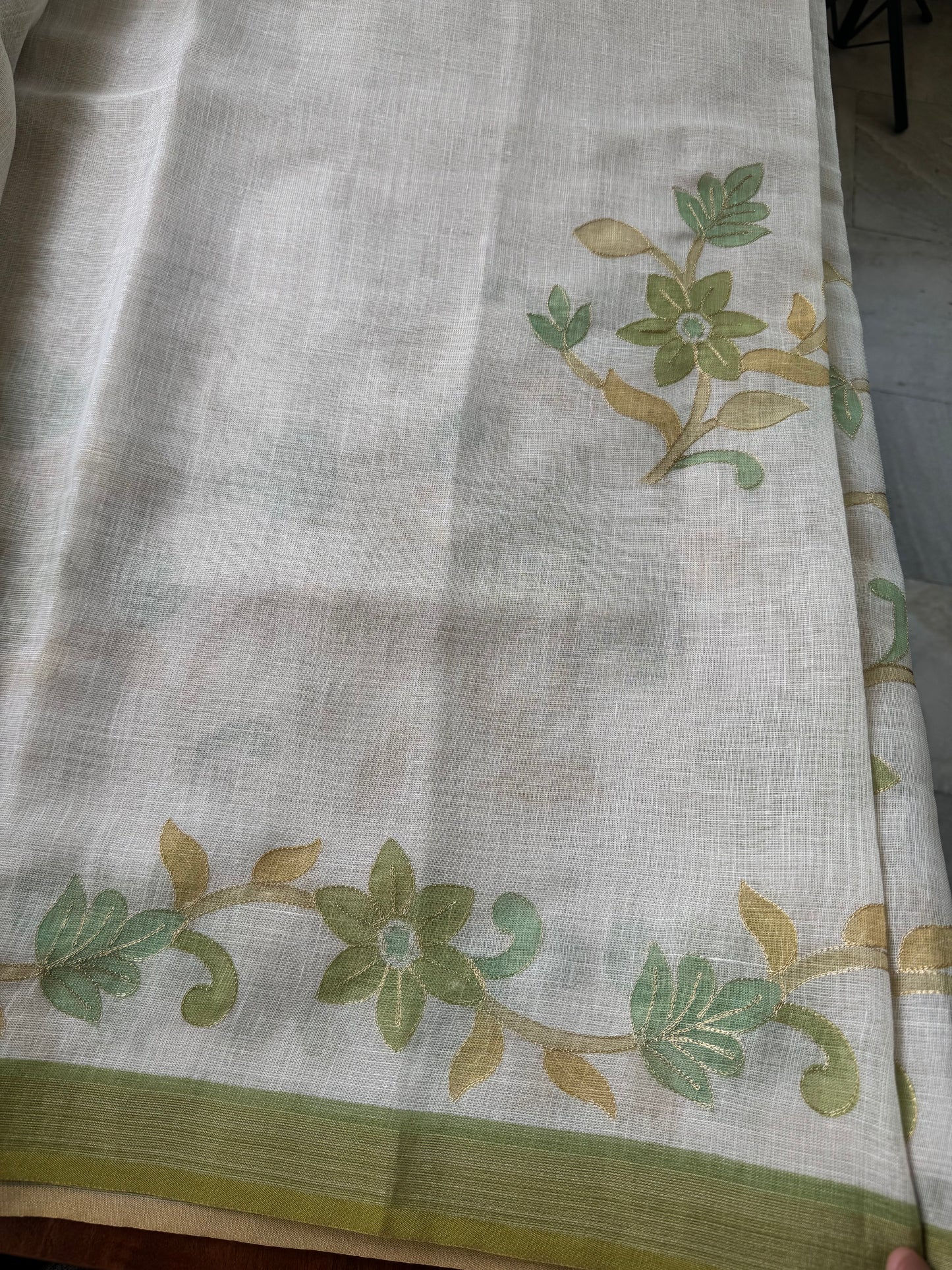 Tissue Linen Saree with Aari work - Half White & Green